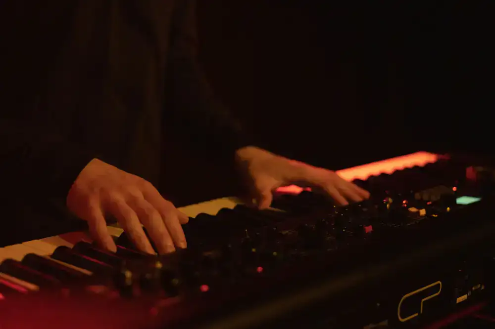 Hands playing digital piano